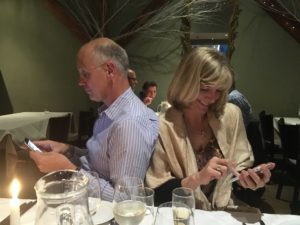 Texting at dinner .. how wude! 